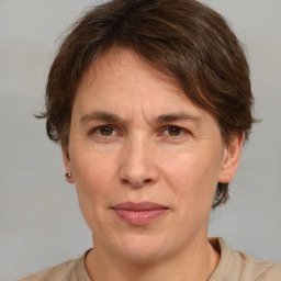 Joyful white adult male with short  brown hair and grey eyes