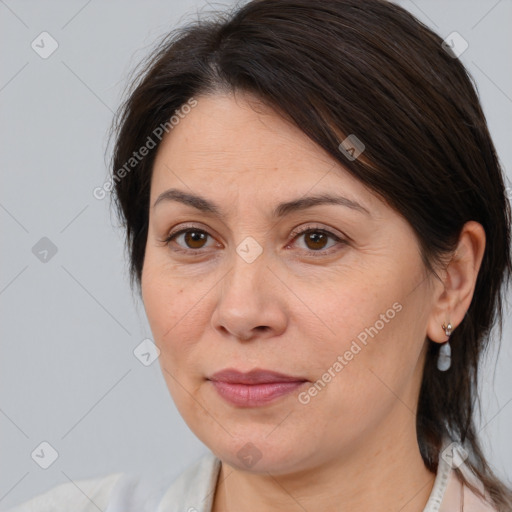 Joyful white adult female with medium  brown hair and brown eyes