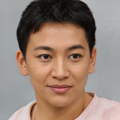 Joyful latino young-adult male with short  brown hair and brown eyes