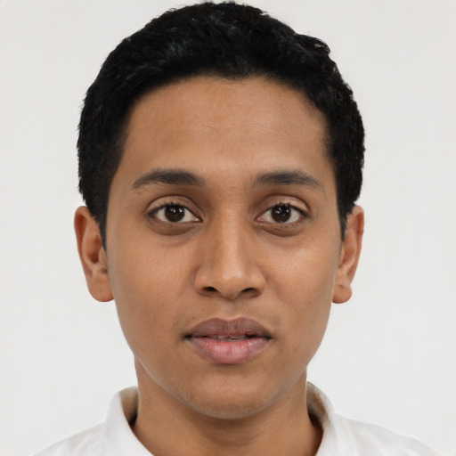 Joyful latino young-adult male with short  black hair and brown eyes
