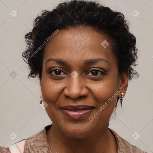 Joyful black adult female with medium  brown hair and brown eyes