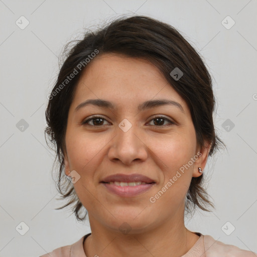 Joyful latino young-adult female with medium  brown hair and brown eyes