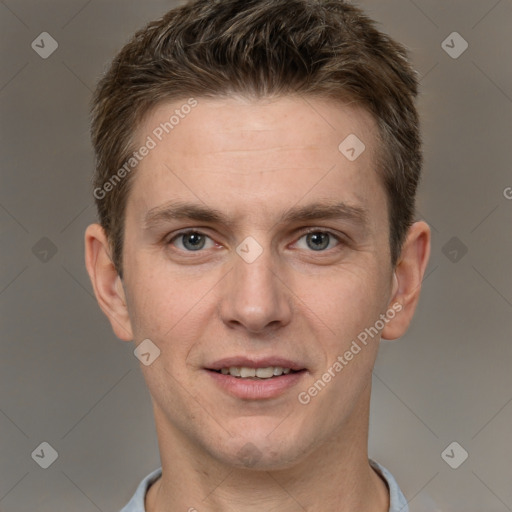 Joyful white adult male with short  brown hair and grey eyes