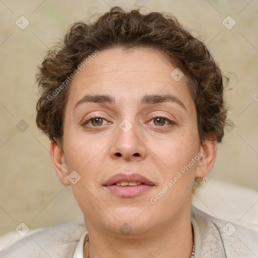 Joyful white adult female with short  brown hair and brown eyes