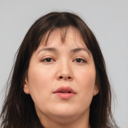 Neutral asian young-adult female with medium  brown hair and brown eyes