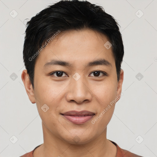 Joyful asian young-adult male with short  black hair and brown eyes