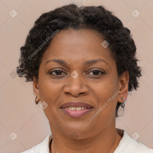 Joyful black adult female with short  brown hair and brown eyes