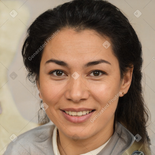 Joyful latino adult female with medium  brown hair and brown eyes