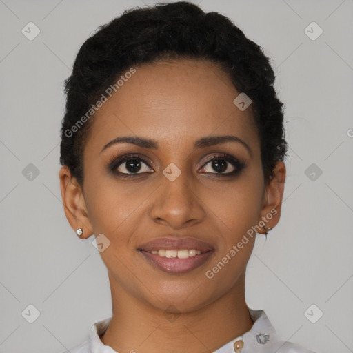 Joyful black young-adult female with short  brown hair and brown eyes