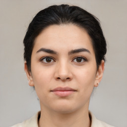 Joyful asian young-adult female with medium  brown hair and brown eyes