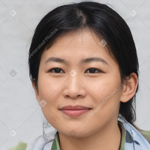 Joyful asian young-adult female with medium  black hair and brown eyes