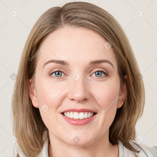 Joyful white young-adult female with medium  brown hair and blue eyes