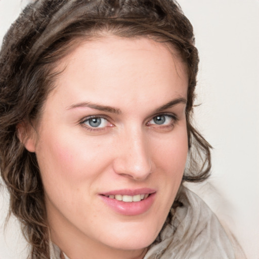 Joyful white young-adult female with medium  brown hair and blue eyes