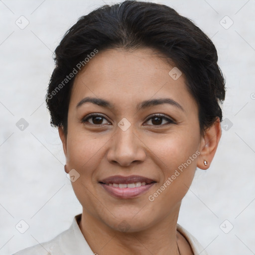 Joyful latino young-adult female with short  brown hair and brown eyes