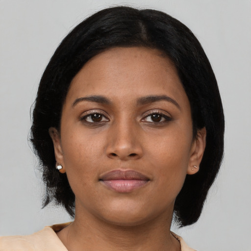 Neutral black young-adult female with medium  black hair and brown eyes