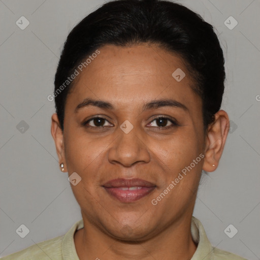 Joyful latino adult female with short  brown hair and brown eyes