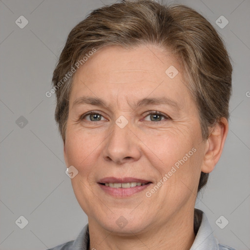 Joyful white adult female with short  brown hair and brown eyes