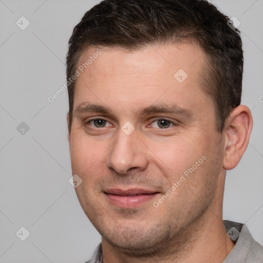 Joyful white adult male with short  brown hair and brown eyes