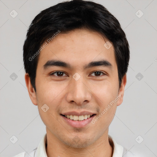 Joyful white young-adult male with short  black hair and brown eyes