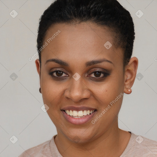 Joyful black young-adult female with short  brown hair and brown eyes