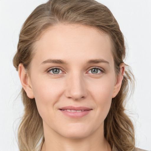 Joyful white young-adult female with medium  brown hair and blue eyes