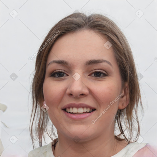 Joyful white young-adult female with medium  brown hair and grey eyes