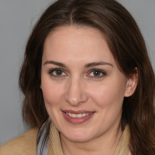 Joyful white young-adult female with medium  brown hair and brown eyes