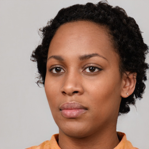 Neutral black young-adult female with short  black hair and brown eyes