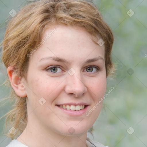 Joyful white young-adult female with medium  brown hair and green eyes