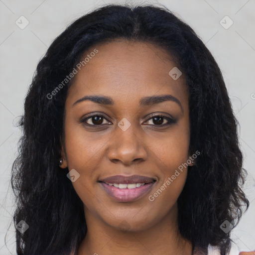 Joyful black young-adult female with long  black hair and brown eyes