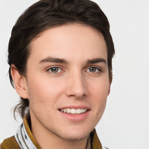 Joyful white young-adult male with medium  brown hair and brown eyes