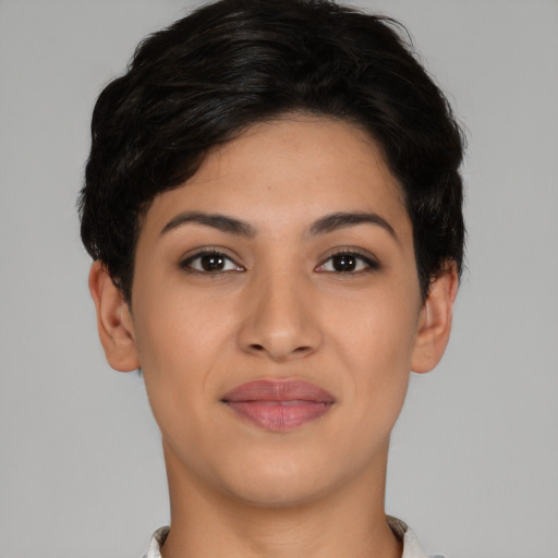 Joyful latino young-adult female with short  brown hair and brown eyes
