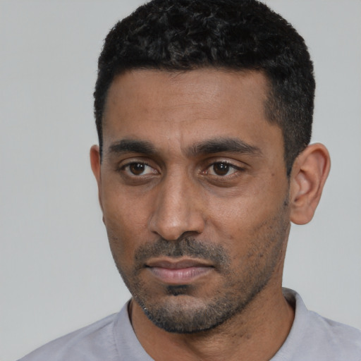 Neutral black young-adult male with short  black hair and brown eyes