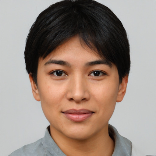 Joyful latino young-adult female with short  black hair and brown eyes