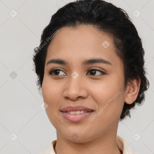 Joyful latino young-adult female with short  brown hair and brown eyes