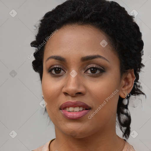 Joyful black young-adult female with short  black hair and brown eyes