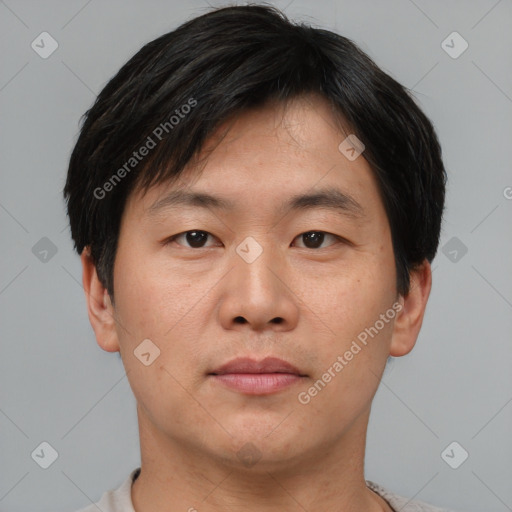 Neutral asian young-adult male with short  brown hair and brown eyes