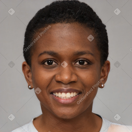 Joyful black young-adult female with short  black hair and brown eyes