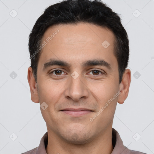 Joyful white young-adult male with short  black hair and brown eyes