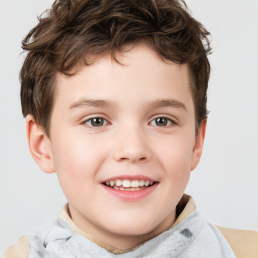 Joyful white child male with short  brown hair and brown eyes