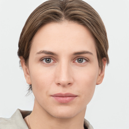 Joyful white young-adult female with short  brown hair and grey eyes