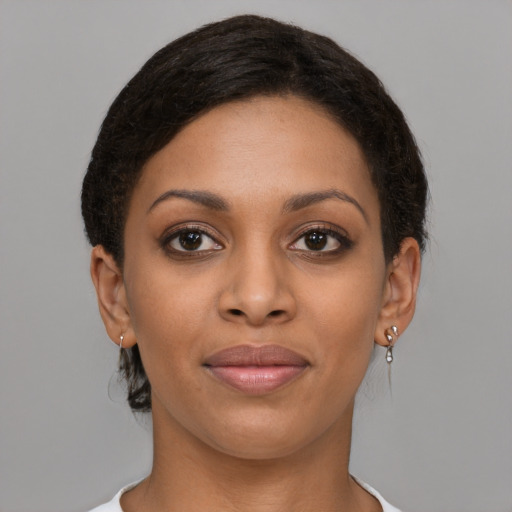 Joyful latino young-adult female with short  brown hair and brown eyes
