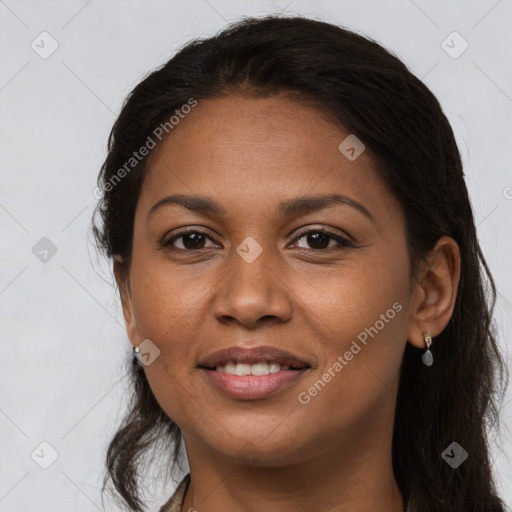 Joyful latino young-adult female with long  brown hair and brown eyes