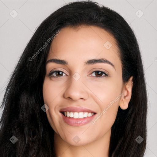 Joyful latino young-adult female with long  black hair and brown eyes