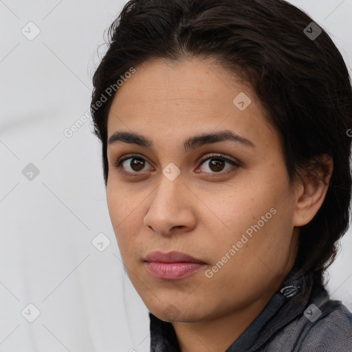 Neutral white young-adult female with long  brown hair and brown eyes