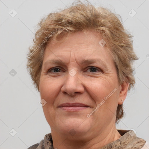 Joyful white middle-aged female with medium  brown hair and brown eyes