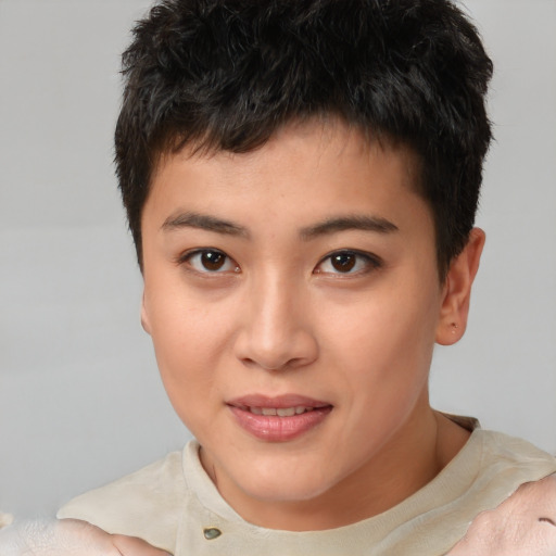 Joyful asian young-adult male with short  brown hair and brown eyes