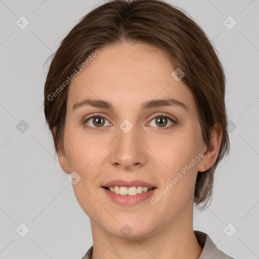 Joyful white young-adult female with medium  brown hair and grey eyes