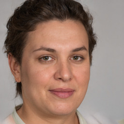 Joyful white adult female with short  brown hair and brown eyes