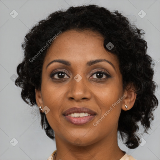 Joyful black adult female with medium  brown hair and brown eyes